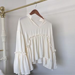 Off-white, bell sleeve, flowy with ruffle details